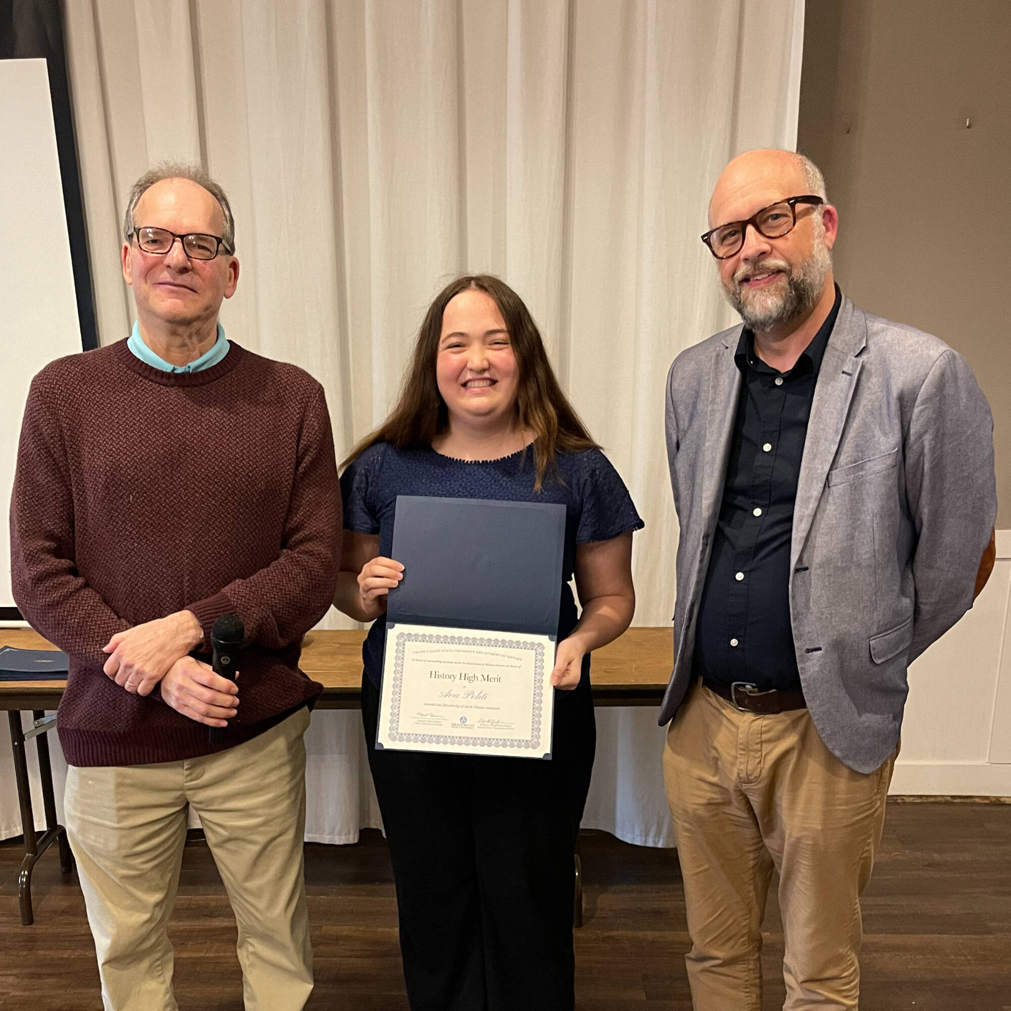 Ava Politi holding award with professors Montagna & Huner
